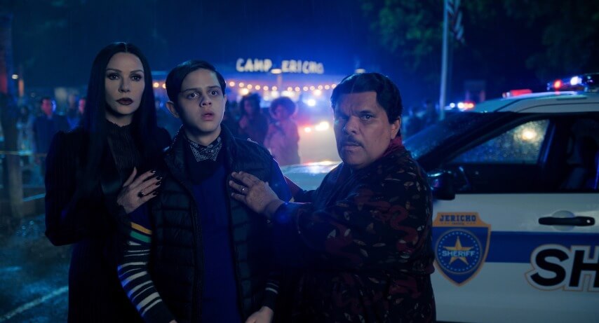 (L to R) Catherine Zeta-Jones as Morticia Addams, Isaac Ordonez as Pugsley Addams, Luis Guzmán as Gomez Addams in episode 203 of Wednesday. Cr. Courtesy of Netflix