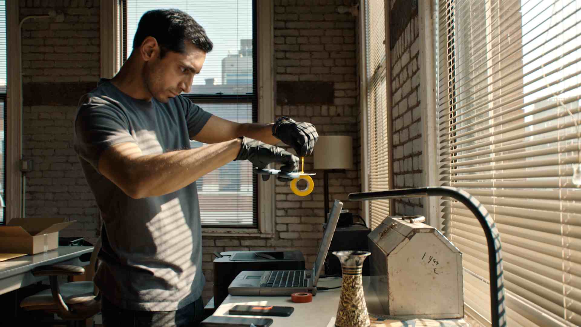 Sharp but shallow, Relay gives Riz Ahmed his own Michael Clayton-style thriller