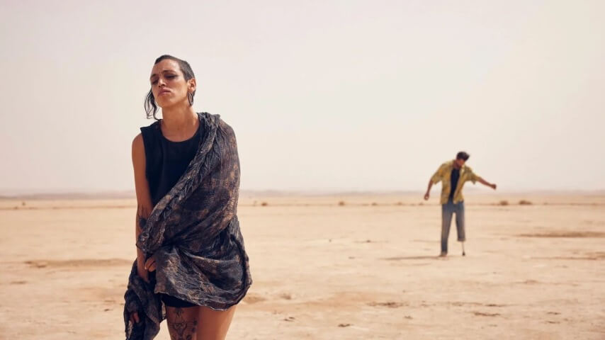 The pulse-pounding Sirāt goes full Burning Man as the world burns