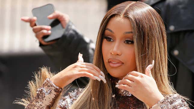 Cardi B Hurls Microphone at Woman Who Threw a Drink at Her Onstage