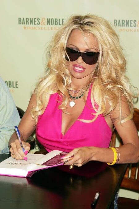 Well, here’s Pam Anderson wearing sunglasses indoors