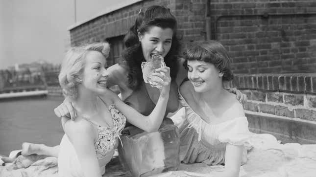 Here's Audrey Hepburn As a Chorus Girl Balancing Her Friend's Butt on a Block of Ice