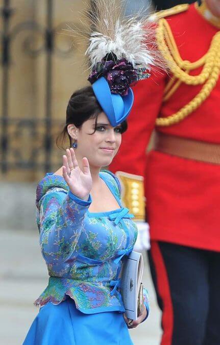 This is a hat that says, “I’m sorry I took your umbrella, Leonard, and also, theoretically, about social classes.”