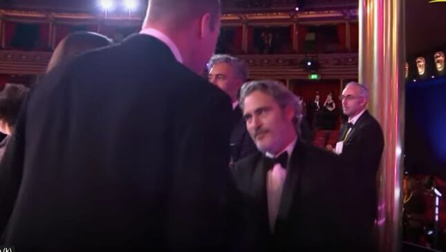 Joaquin Phoenix Curtsying to Prince William Is an Instant Classic