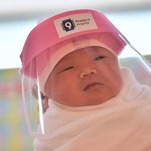 Here's a Slightly Crotchety Baby In the Tiniest PPE You've Ever Seen