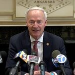 Arkansas Governor Belatedly Realizes Wanting Trans Kids to Die Is Perhaps a Bad Look