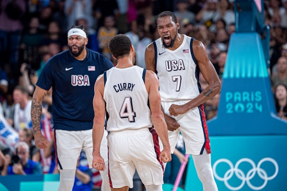 PARIS, FRANCE - AUGUST 8: Stephen Curry celebrates with Kevin Durant #7 of United States during a Men's basketball semifinals match between Team United States and Team Serbia on day thirteen of the Olympic Games Paris 2024 at Bercy Arena on August 08, 2024 in Paris, France. 