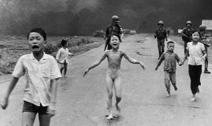 Phan Thi Kim Phúc, center, running down a road naked near Trảng Bàng after a South Vietnam Air Force napalm attack (Nick Ut/The Associated Press/Wikimedia Commons)