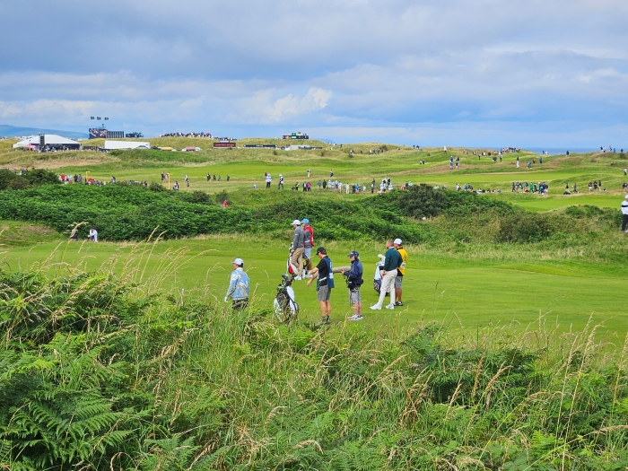 A photo of Royal Portrush with US Ryder Cup Captain Keegan Bradley in the fairway with Sungjae Im and Daniel Berger