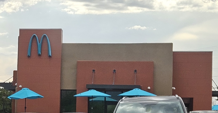 A McDonald's where the golden arches are turquoise 