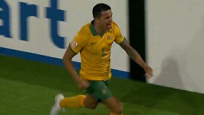 Watch Tim Cahill Get Back on His Bike vs China