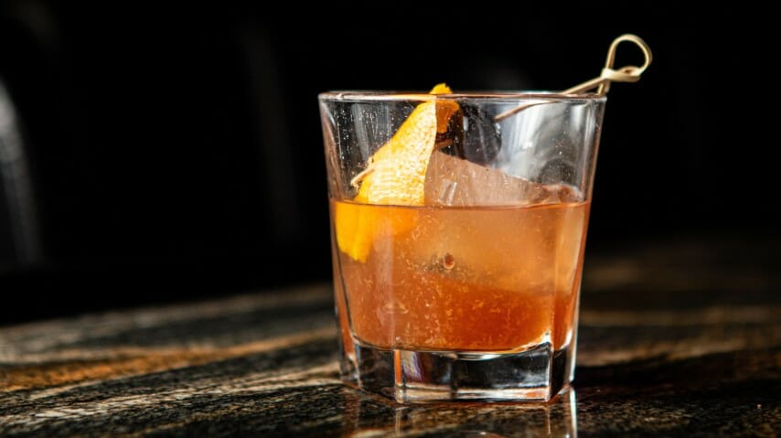 Cocktail Queries: Why Flame a Citrus Peel Above a Drink?