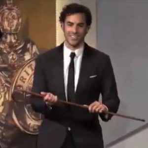 Watch Sasha Baron Cohen Push an Old (Stunt) Woman off the Stage at the Britannia Awards