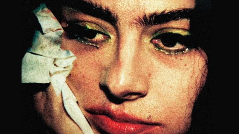 The lack of music in The moment only reveals the emptiness of its satire